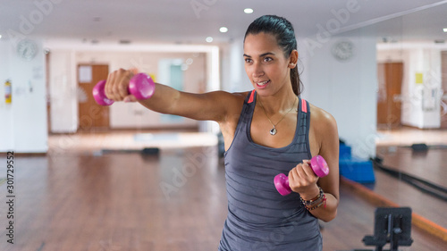 beautiful latin woman in the gym photo