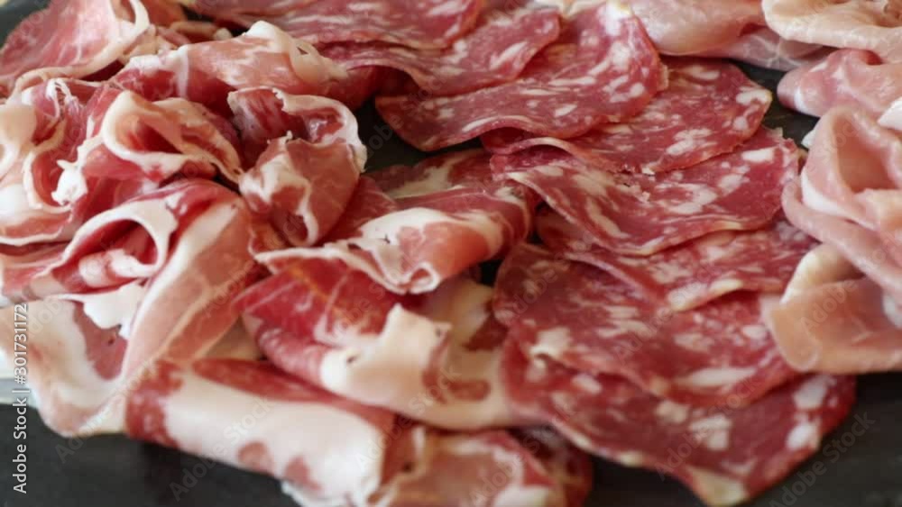 Cheese and meat appetizer selection. Prosciutto di Parma, salami, italian cheese, bread sticks, olives and tomatoes on wooden board Cheese and meat appetizer selection. Prosciutto di Parma, salami, italian cheese, bread sticks, olives and tomatoes on wooden board