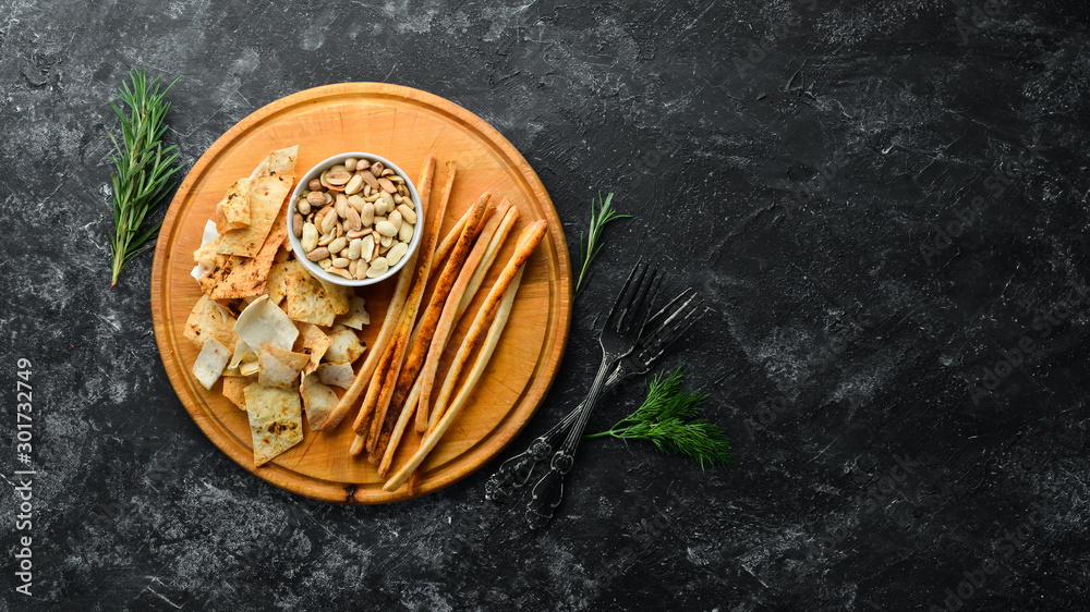 Salty appetizers for beer. Snacks and peanuts. Top view. Free copy space. Salty appetizers for beer. Snacks and peanuts. Top view. Free copy space.