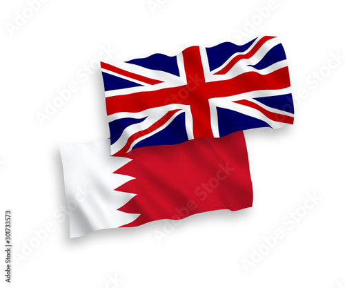 National vector fabric wave flags of Great Britain and Bahrain isolated on white background. 1 to 2 proportion.