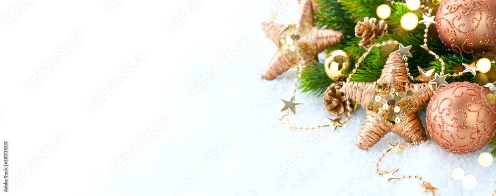 Gold vintage Christmas and New Year Decoration isolated on white background. Border art design with holiday baubles. Beautiful Xmas tree closeup decorated with balls, tinsel, cones. Space for text - obrazy, fototapety, plakaty 