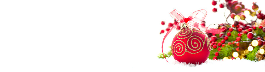 Red Christmas and New Year Decoration isolated on white background. Border art design with holiday baubles. Beautiful Xmas tree closeup decorated with balls, holly berry. Space for text