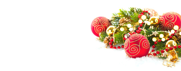 Red Christmas and New Year Decoration isolated on white background. Border art design with holiday baubles. Beautiful Xmas tree closeup decorated with balls, holly berry. Space for text