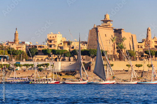 Luxor Temple is a large Ancient Egyptian temple complex on east bank of Nile river in Luxor (ancient Thebes). View from Nile river photo