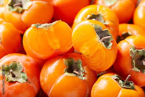 Photos fresh ripe persimmon fruit as background