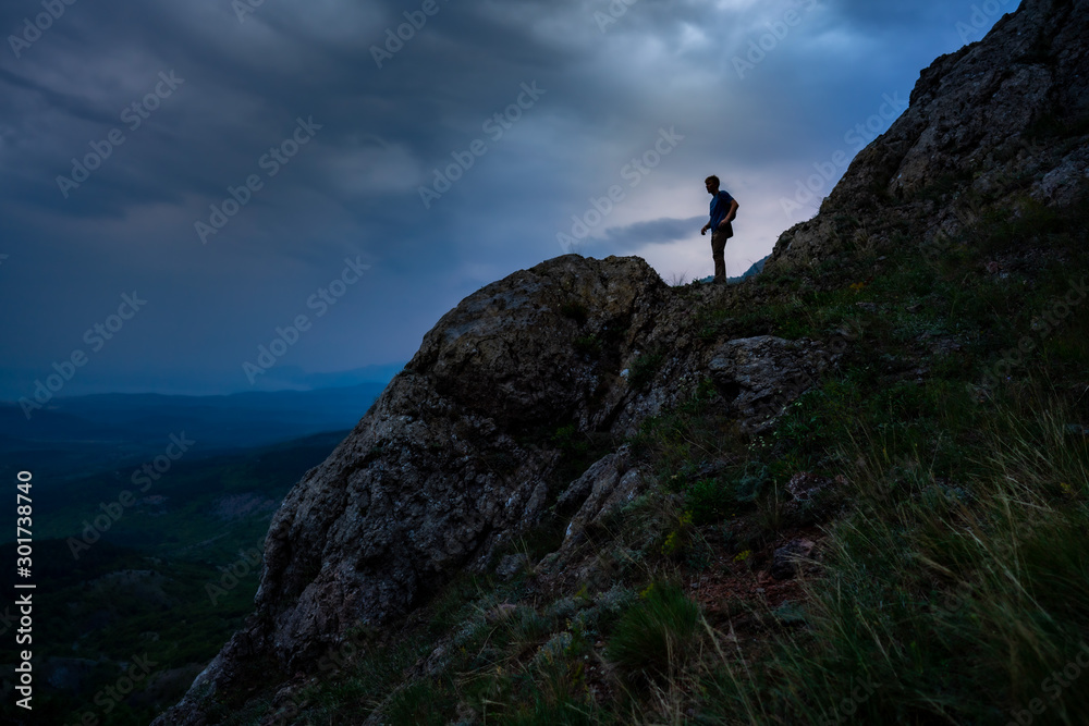 Hiker is looking on valley from Mountain in Crimea, Travel during Summer