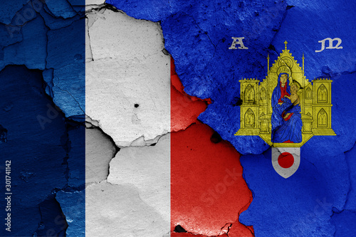 flags of France and Montpellier painted on cracked wall