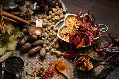 Spices and herbs on old kitchen table.