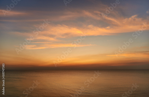 sunset over the sea  clouds  skyline 