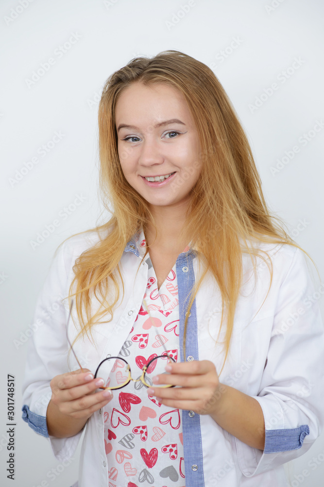 Portrait of young female doctor in white coat Portrait of young female doctor in white coat