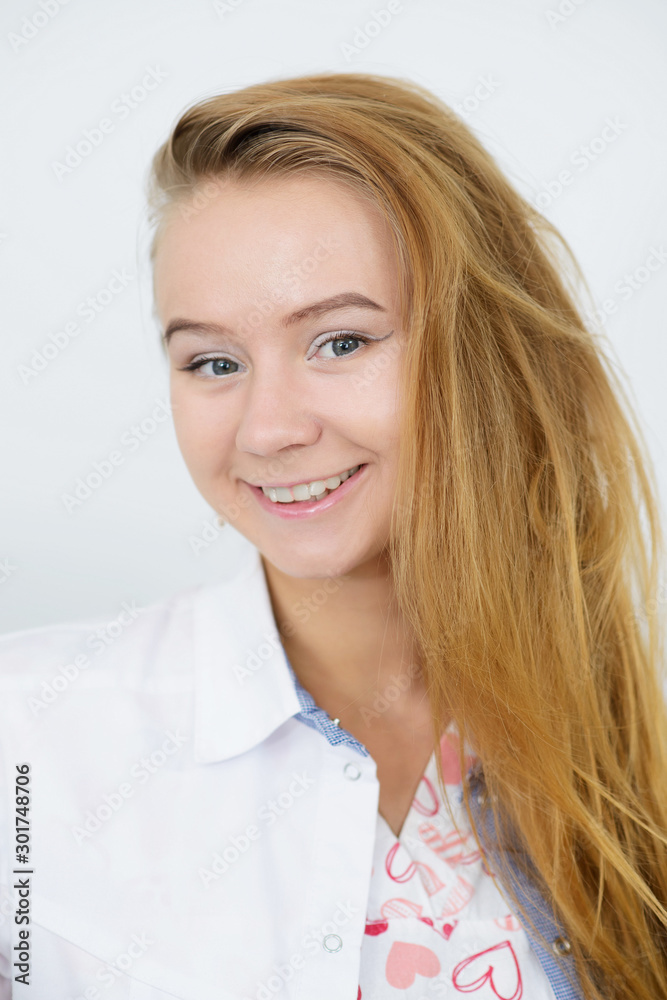 Portrait of young female doctor in white coat Portrait of young female doctor in white coat