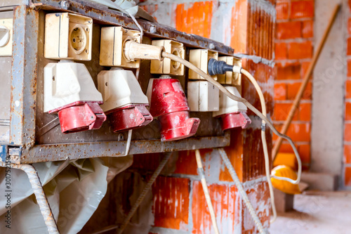 Industrial power outlets, electric plug in, at construction site photo