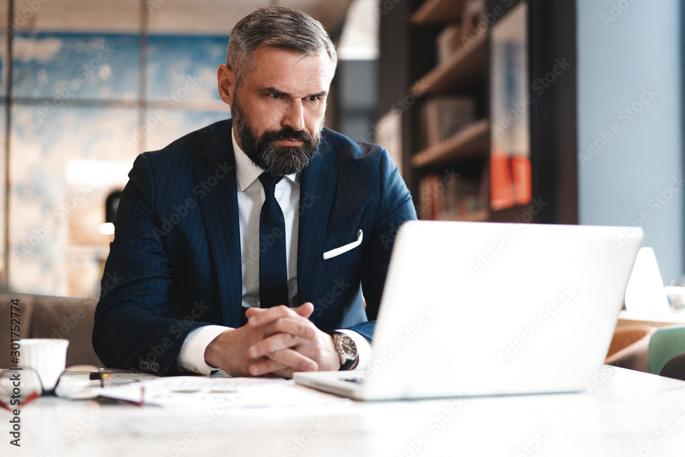 business man working with documents and laptop business man working with documents and laptop