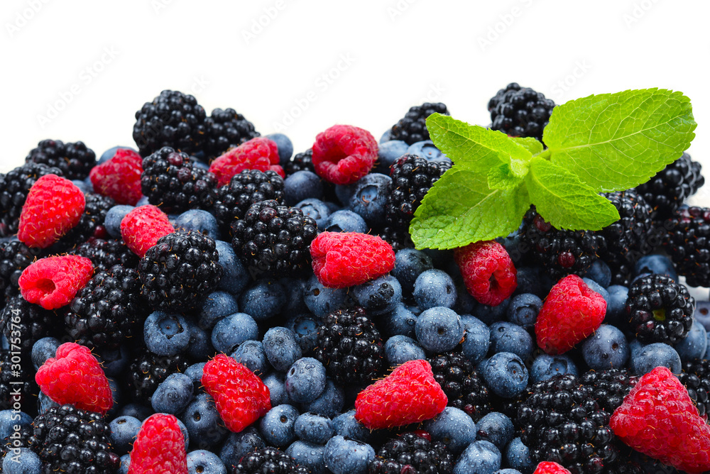 Blackberry, raspberry, blueberry and mint background.