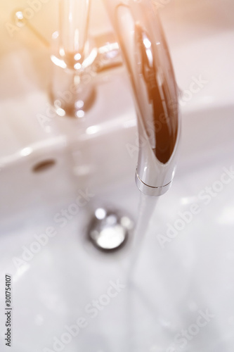 Εκτύπωση καμβά Saving water: Close up of spigot with clear, flowing water
