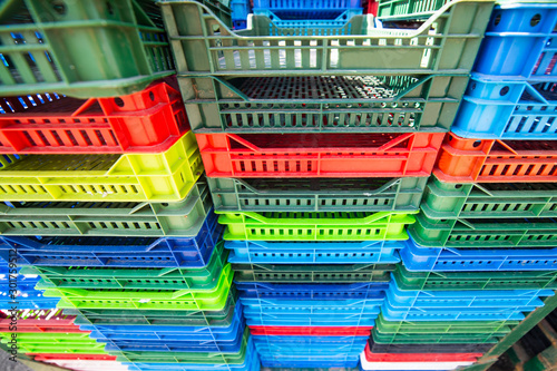 Colorful plastic boxes stacked one upon the other