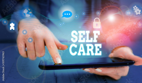 Writing note showing Self Care. Business concept for the practice of taking action to improve one s is own health Picture photo network scheme with modern smart device