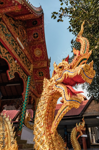 Dragon guard statue at the thai buddhist temple entrance