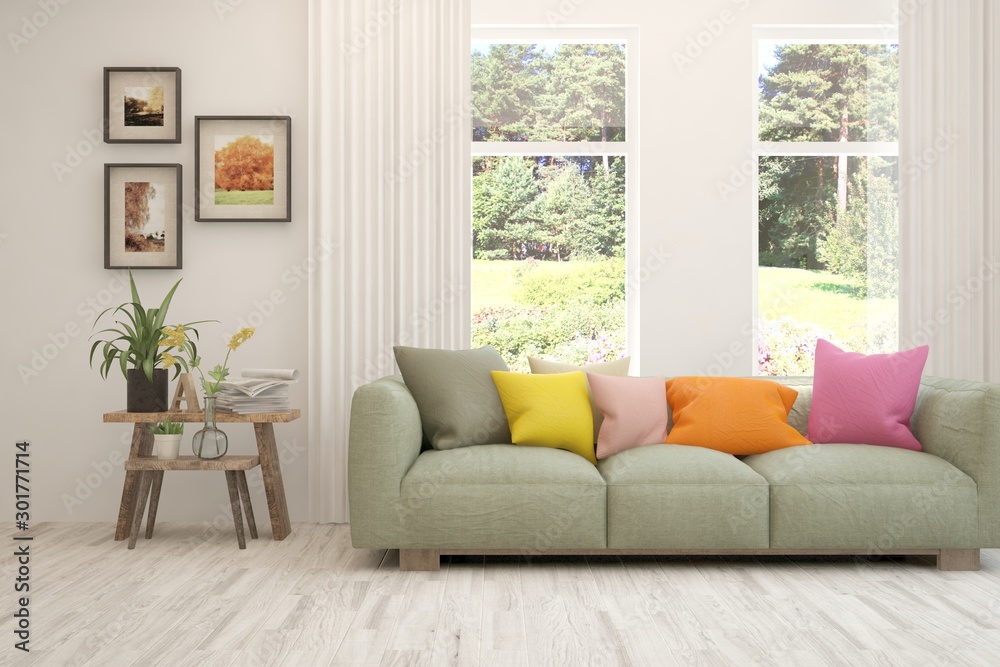 Fototapeta premium Stylish room in white color with sofa and summer landscape in window. Scandinavian interior design. 3D illustration