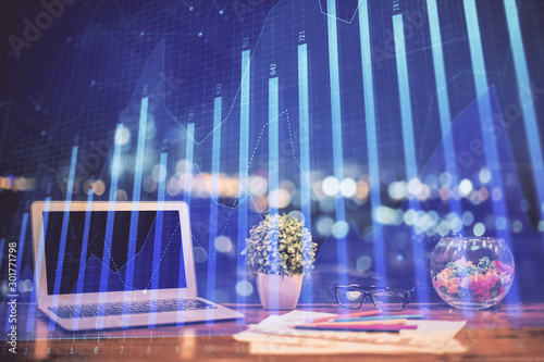 Forex graph hologram on table with computer background. Double exposure. Concept of financial markets.