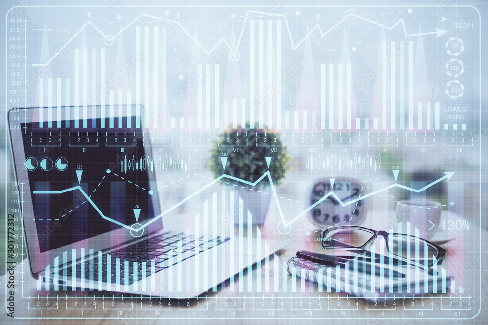 Forex market graph hologram and personal computer on background. Multi exposure. Concept of investment. Forex market graph hologram and personal computer on background. Multi exposure. Concept of investment.