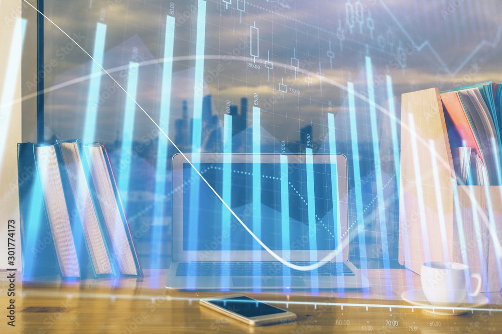 Financial market graph hologram and personal computer on background. Multi exposure. Concept of forex. Financial market graph hologram and personal computer on background. Multi exposure. Concept of forex.
