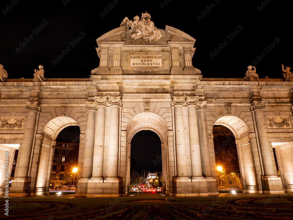  monument of the alcala de madrid gate illuminated at night