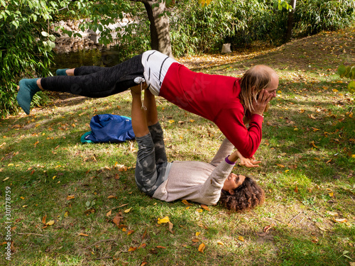  nomadic travelers practicing yoga in the park