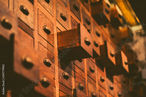 Fotografie Old wooden textured drawers background in chinese herbal medicine shop in china