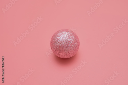 Pink background with pink balls. Christmas flay lay. Top view