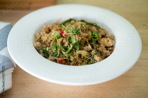 Stir fried vermicelli with minced pork and Cha-om leave.
