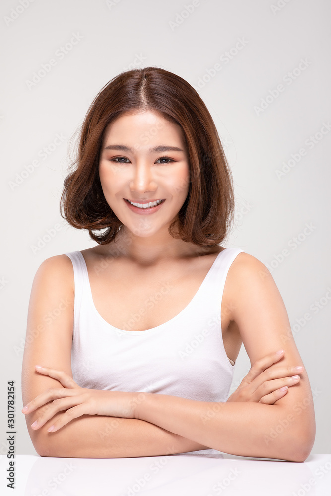 Beautiful Asian woman with short hair looking at camera smile with clean and fresh skin Happiness and cheerful with positive emotional,isolated on gray background,Beauty and Cosmetics Concept Beautiful Asian woman with short hair looking at camera smile with clean and fresh skin Happiness and cheerful with positive emotional,isolated on gray background,Beauty and Cosmetics Concept