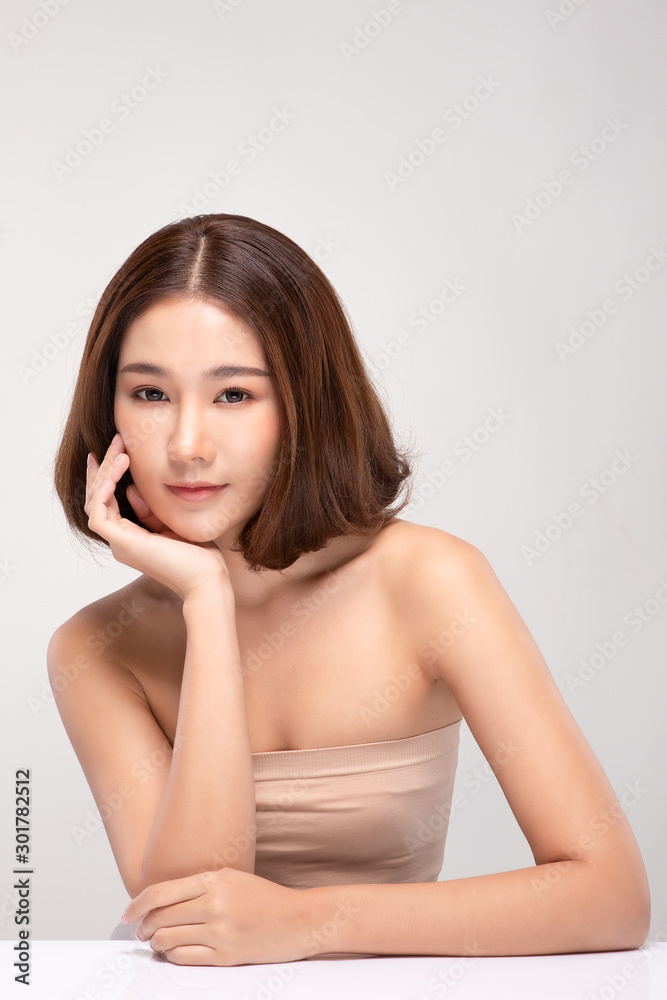 Beautiful Asian young woman touching soft cheek smile with clean and fresh skin Happiness and cheerful with positive emotional,isolated on gray background,Beauty and Cosmetics Concept Beautiful Asian young woman touching soft cheek smile with clean and fresh skin Happiness and cheerful with positive emotional,isolated on gray background,Beauty and Cosmetics Concept