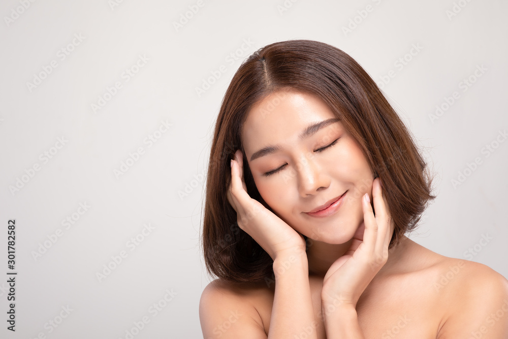 Beautiful Asian young woman touching soft cheek smile with clean and fresh skin Happiness and cheerful with positive emotional,isolated on gray background,Beauty and Cosmetics Concept Beautiful Asian young woman touching soft cheek smile with clean and fresh skin Happiness and cheerful with positive emotional,isolated on gray background,Beauty and Cosmetics Concept