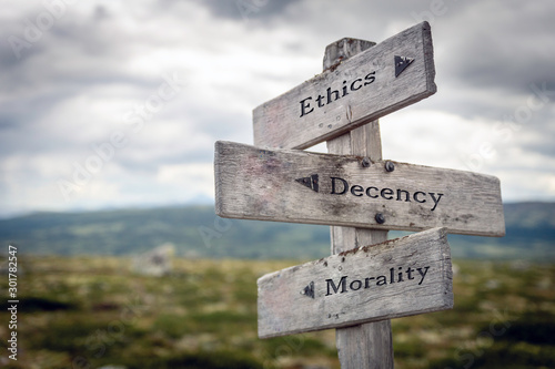 Ethics, decency and morality text on wooden sign post outdoors in landscape scenery. Business, quotes and motivational theme concept. photo