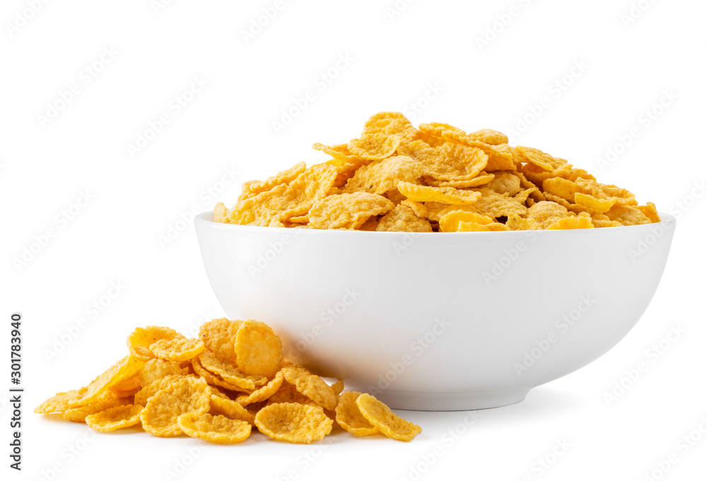 Cornflakes in a plate and scattered on a white. Isolated Cornflakes in a plate and scattered on a white. Isolated