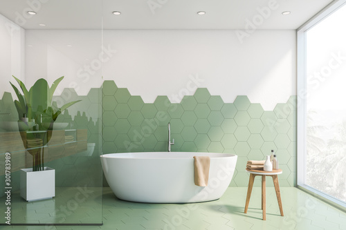 Fototapeta Green and white tile bathroom interior, tub