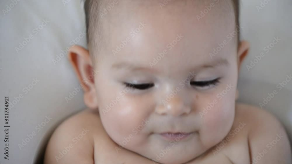 smiling portrait of cute happy baby with brown big eyes. Joyful childhood smiling portrait of cute happy baby with brown big eyes. Joyful childhood