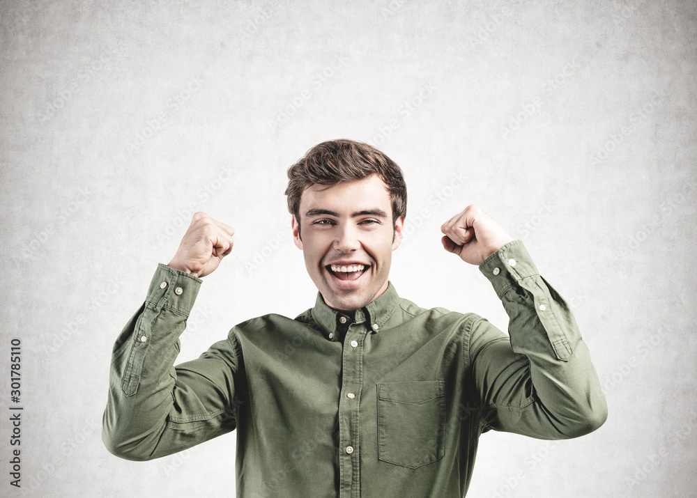 Fototapeta premium Happy smart casual man screaming, concrete