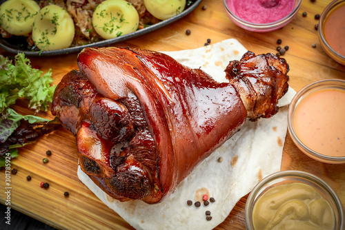 Photography Baked pork shank with sauerkraut with bigus