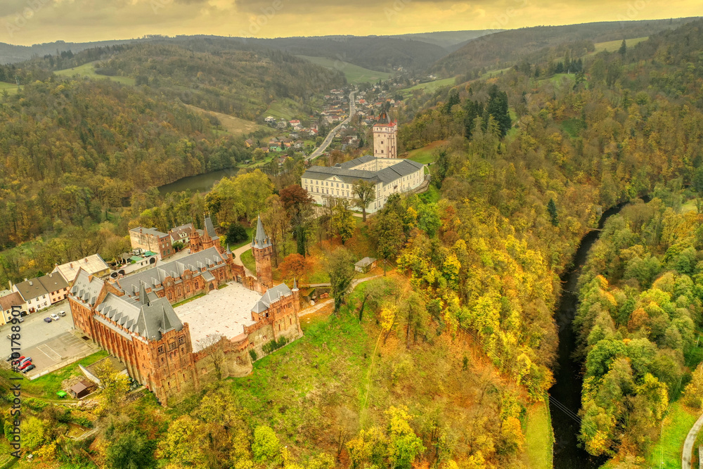 aerial shot of  two castle side by side in Hradec nad moravici one red and one bily in autumn colors