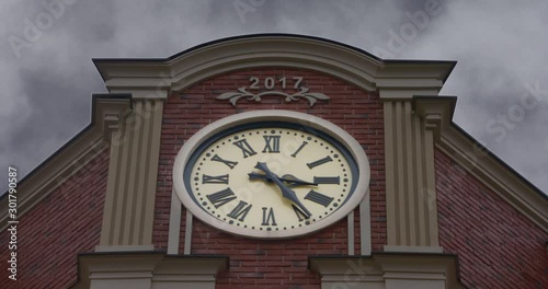 Old clock on the building. Time-lapse. Moving forward time.