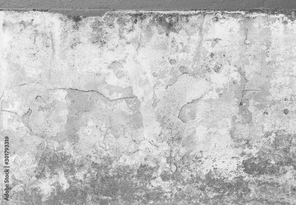 Weathered and cracked plastered concrete wall with mold. Plastering is partly peeled off. High resolution full frame textured background in black and white.