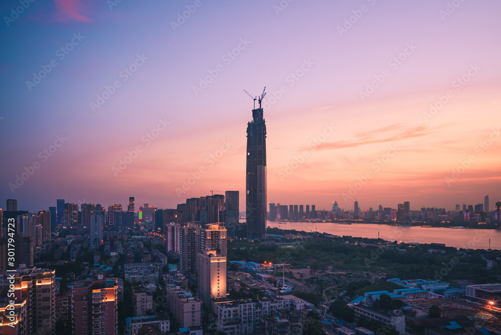 Wuhan skyline and Yangtze river with supertall skyscraper under construction in Wuhan Hubei China.