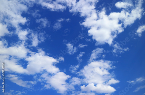 Fototapeta Naklejka Na Ścianę i Meble -  Vivid blue sky with white scattered clouds