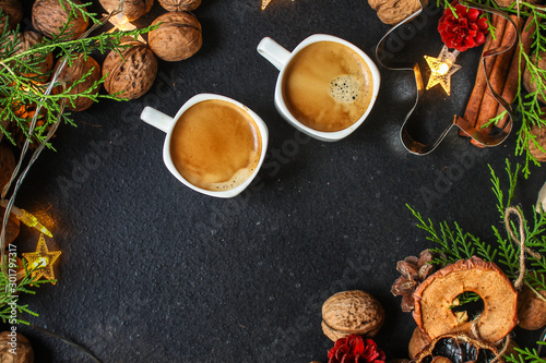 coffee, New Year, Christmas background or Noel holiday festive (nuts, specials, decorations and gifts on the table, greeting card) menu concept. food background. copy space. Top view