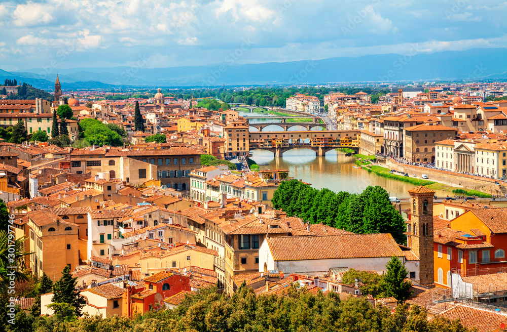 View of medieval stone bridge Ponte Vecchio over Arno river in Florence, Tuscany, Italy. Florence cityscape. Florence architecture and landmark.