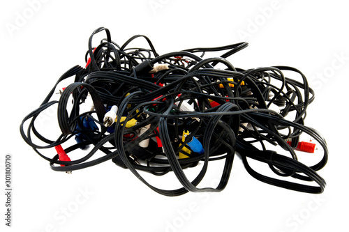 Messy tangle of wires for video on a white background isolated, bundle of audio video electrical leads