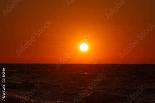An image of a nice red sunset with big yellow sun