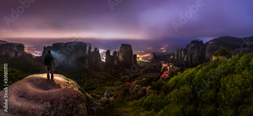 Night Hike in Greek Meteora mountains - overlooking castle-like monasteries photo